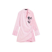 Pink striped cotton v-neck dress by Desigual with a pink and white striped wrap-style blouse and black floral embroidery