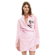 Pink striped cotton v neck dress by Desigual with vertical stripes and black floral embroidery on left chest side