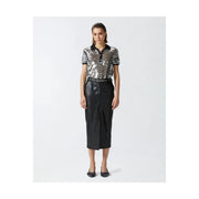 A shimmering silver sequined short-sleeved polo shirt with black collar and cuffs paired with a black polyester skirt with front pockets by pinko women