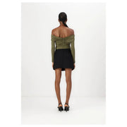 Back view of olive green off-the-shoulder ruched long-sleeve top paired with pinko women black polyester blend mini skirt