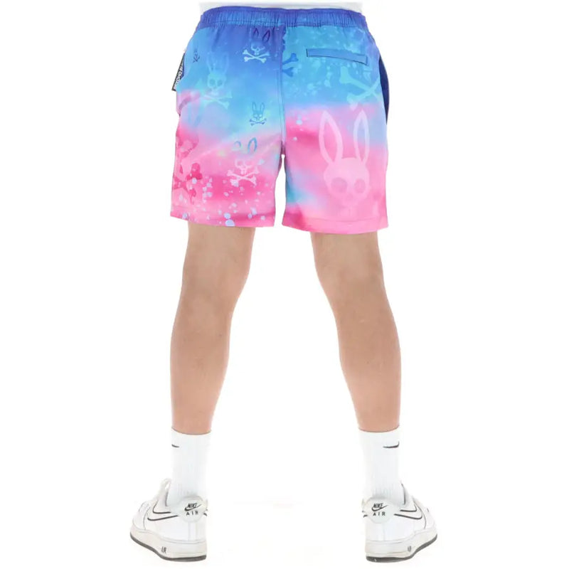 Psycho Bunny Herren-Badehose aus pinkfarbenem Polyester mit blau-pinkem Farbverlauf, Totenkopf- und Hasenmotiven sowie Taschen