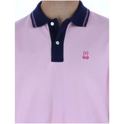 Psycho Bunny Herren-Poloshirt, rosa, kurzärmelig, aus Baumwolle mit marineblauem Kragen und kleinem, gesticktem rosa Hasenlogo