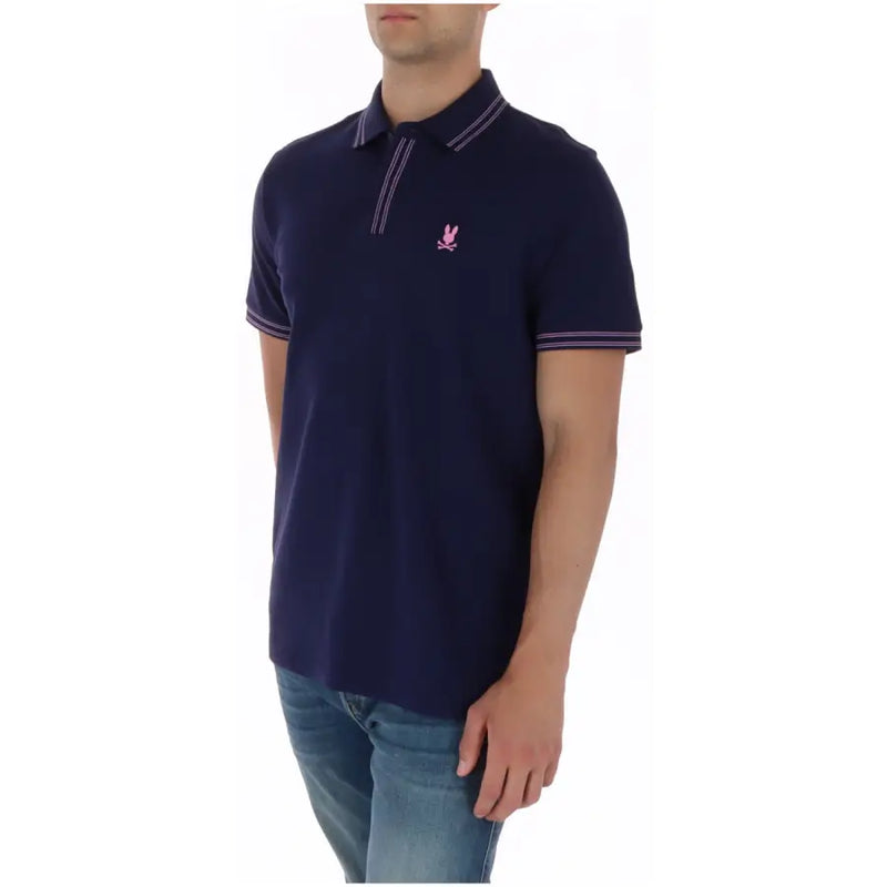 Marineblaues Herren-Polohemd aus Baumwolle mit kurzen Ärmeln und Psycho Bunny-Logo in Rosa-Stickerei sowie weißem Nadelstreifenbesatz.