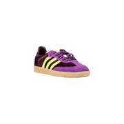 Purple and black suede slip-on sneakers with yellow stripes and gum sole for women