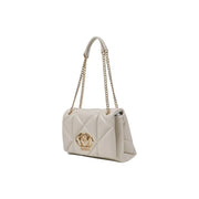 Cream colored quilted shoulder bag with gold chain straps displayed prominently