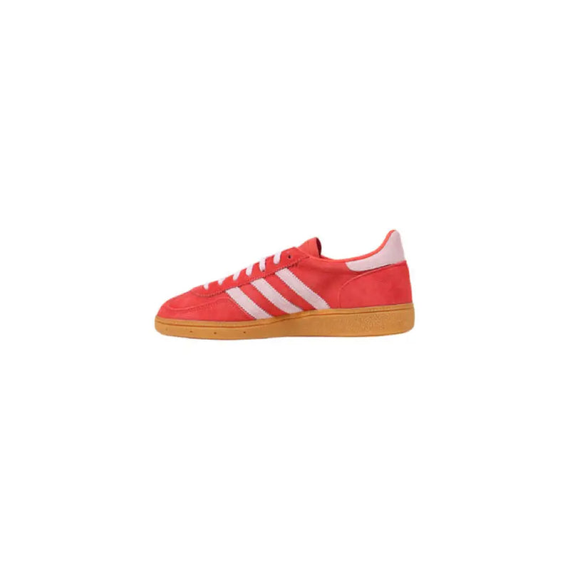 Red Adidas Handball Spezial sneaker with white stripes for athletic footwear display
