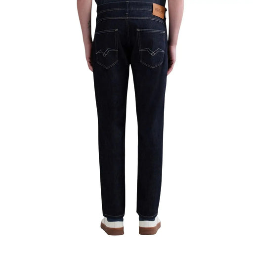 Back side of replay men jeans blue zip button m1008j 000 spring summer dark indigo denim with white stitching and brown leather patch