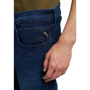 Back side of replay men jeans blue zip button slim fit made of dark blue denim with subtle faded wash and brand label