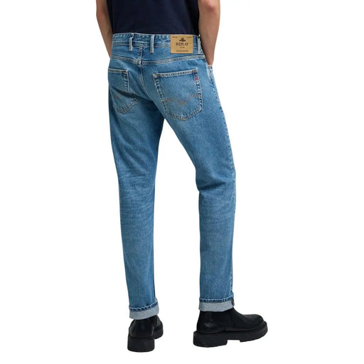 Replay men jeans light blue denim with classic five-pocket design rolled cuffs and relay brand label on waistband