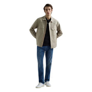Beige utility-style jacket with button closures and two chest pockets paired with replay men straight leg blue stretch denim jeans