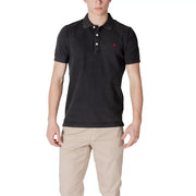 Man wearing a black polo shirt and khaki pants, showcasing Replay Men’s Yellow Polo Shirt