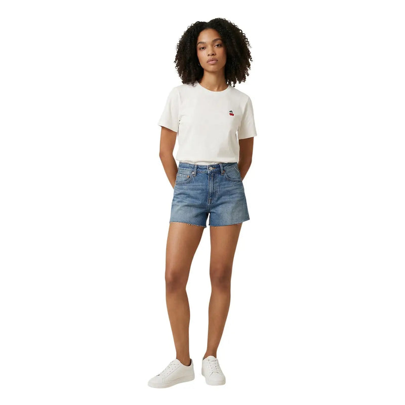 White cotton t-shirt with small embroidered cherry paired with Replay women blue denim shorts with zip pocket casual style