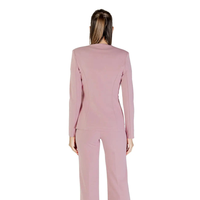 A sleek blush-pink tailored Rinascimento long blazer with rhinestone buttons and matching trousers in structured fabric