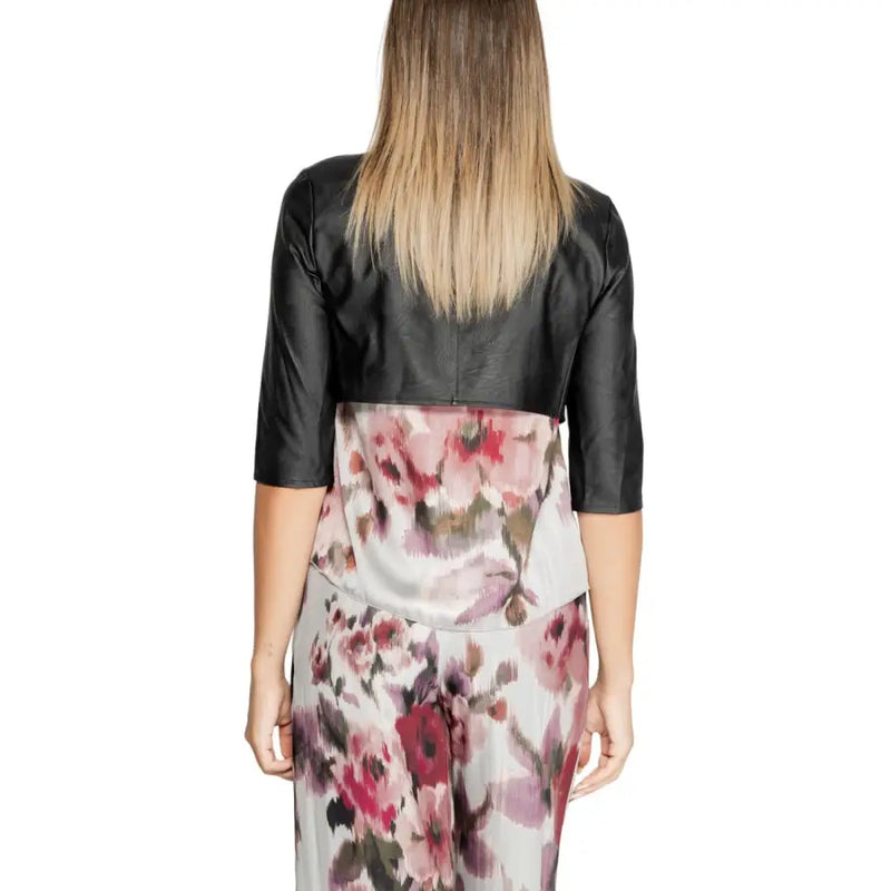 Rinascimento women black polyurethane cropped bolero jacket with three quarter sleeves worn over floral dress