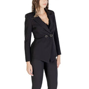 Women’s black tailored blazer with asymmetrical hem, silver ring details, over lace top