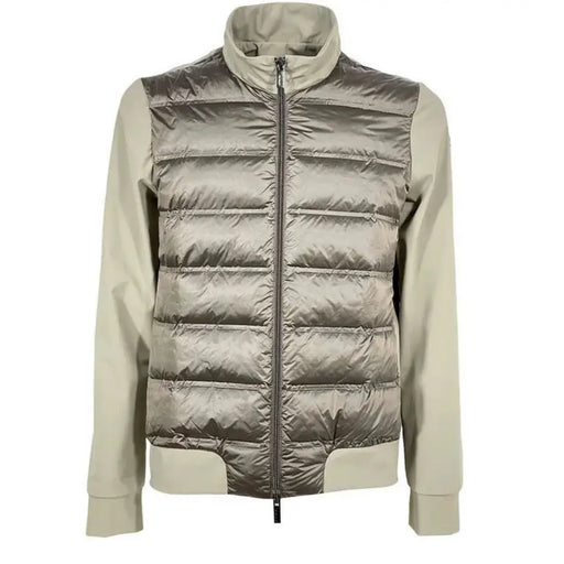 Silver metallic puffer jacket with zipper and contrast sleeves.