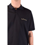 Schwarzes Baumwollpolohemd von Saint Laurent für Herren mit goldgesticktem Schriftzug „Sweet Dreams“ auf der linken Brust, Vorderansicht