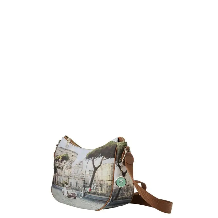 The Sak women bag against urban cityscape for Y Not? product, showcasing urban style clothing