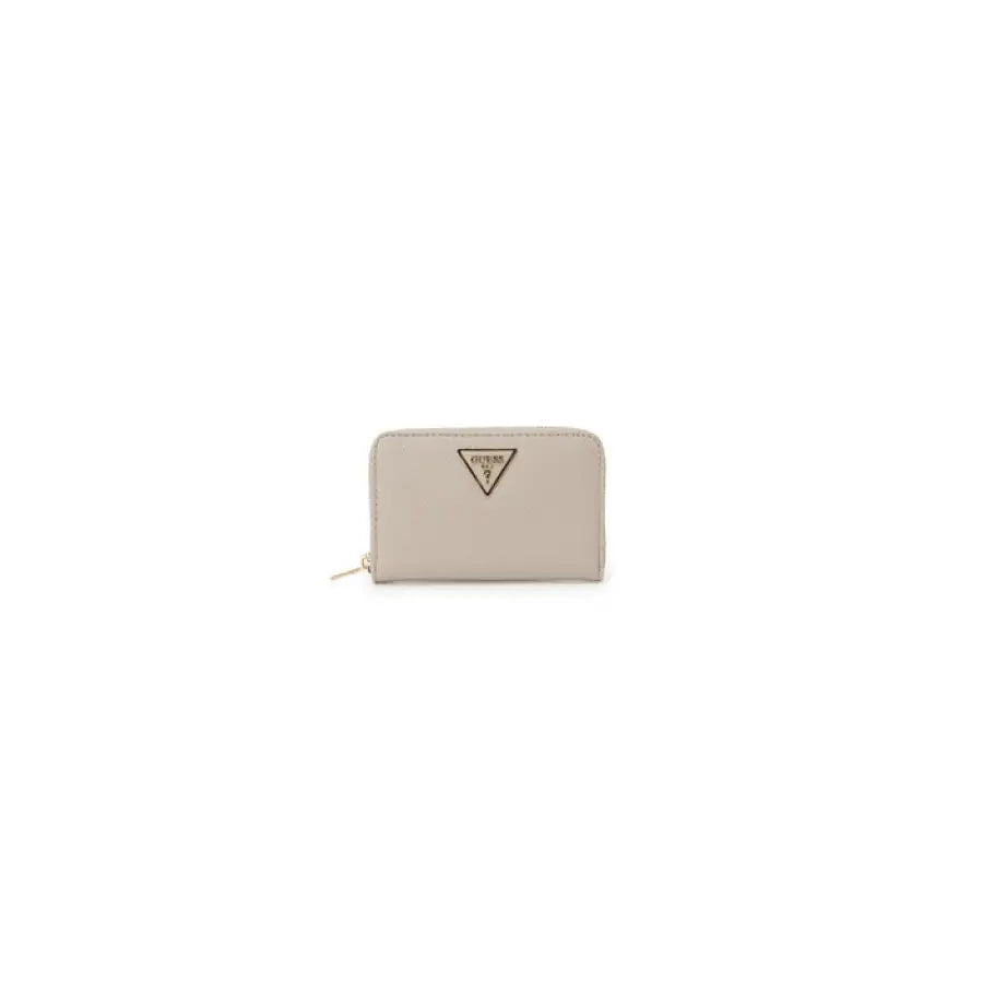 
                      
                        Beige The Sak wallet by Guess, showcasing urban city style fashion
                      
                    