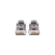 Back view of Saucony unisex chunky sneakers with white and black mesh upper, silver accents, and beige synthetic midsole