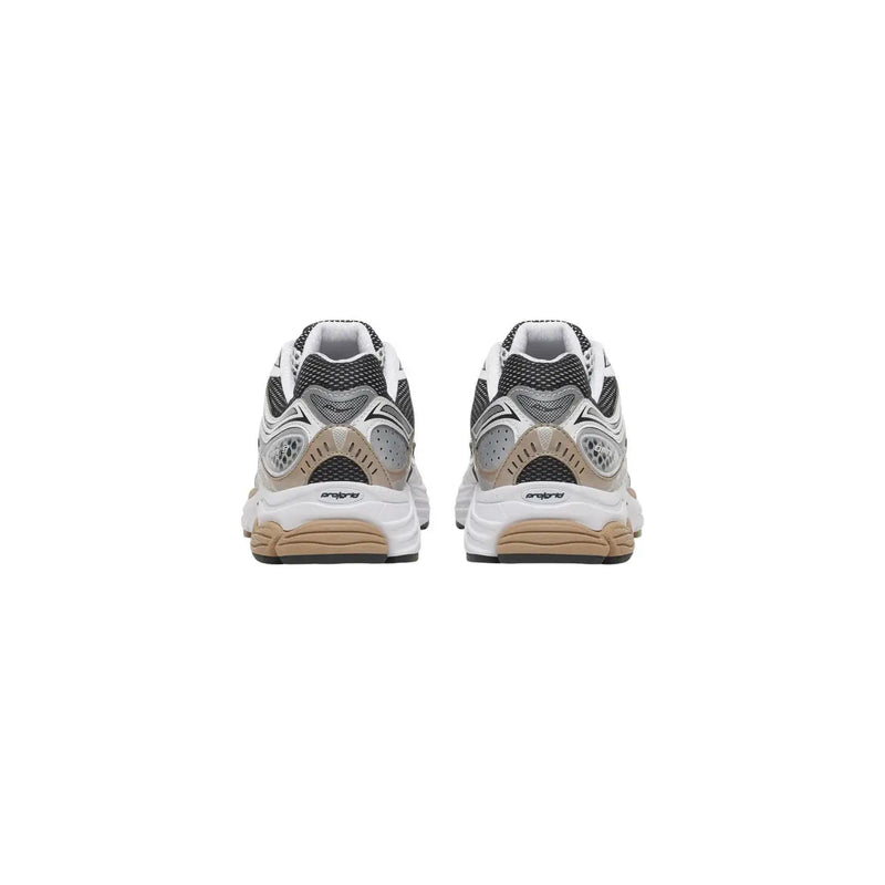Back view of Saucony unisex chunky sneakers with white and black mesh upper, silver accents, and beige synthetic midsole