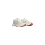 White saucony women leather sneakers ride millennium with gold accents and tan rubber sole for running and casual wear