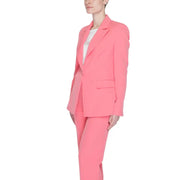 A vibrant coral pink tailored Silence Women blazer with lapel collar, front pockets, and matching modern cut trousers