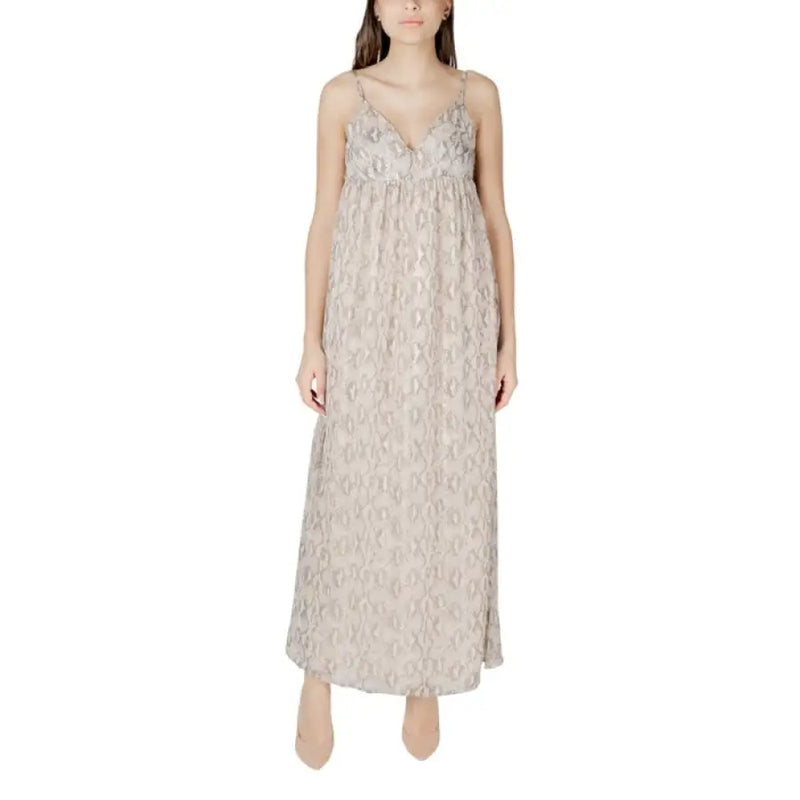Beige patterned sleeveless maxi dress displayed in a product listing