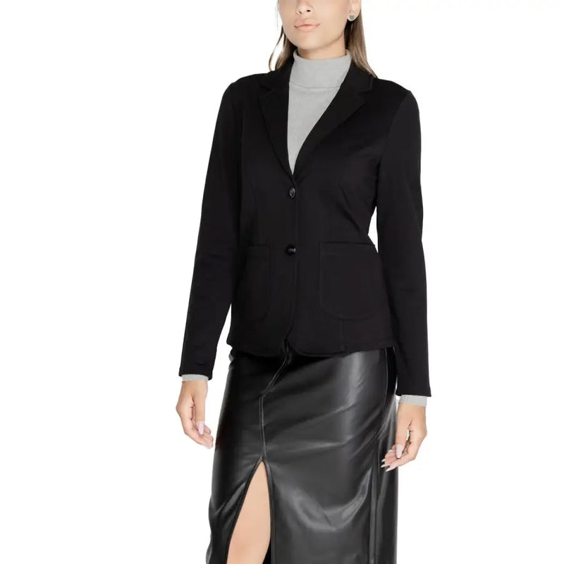 Women wearing Street One black tailored blazer over grey turtleneck and leather midi skirt
