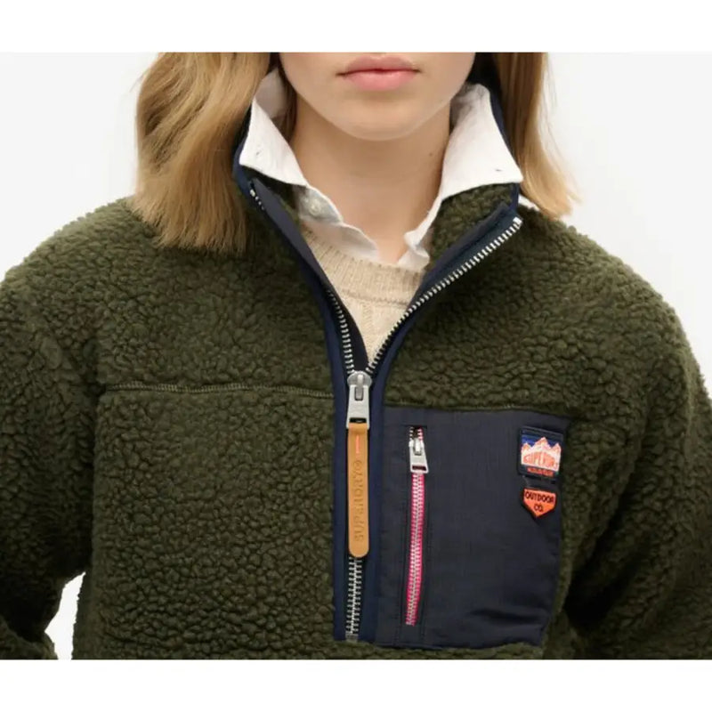 Dark green fleece quarter-zip pullover with navy blue pocket and white collar for women