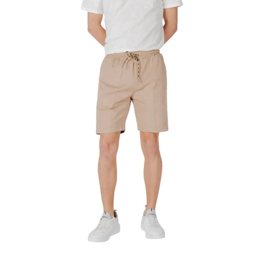 Tan Drawstring Shorts showcased in a retail display, emphasizing casual summer fashion