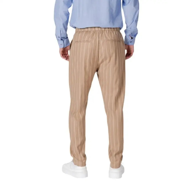 Tan striped trousers from Gianni Lupo featuring laces and pockets for men