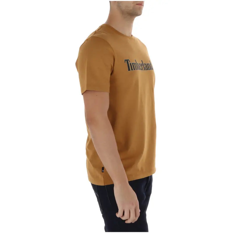 Ein senfgelb Timberland Männer t-shirt hergestellt aus timberland Stoff mit schwarzem Logo auf der Brust