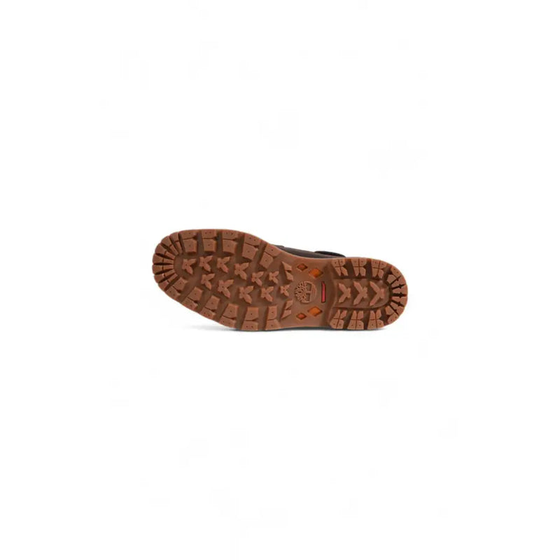 Brown timberland men’s ankle boot sole in leather and rubber with rugged tread and embossed brand logo at the heel back side