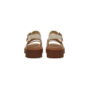 Cream-colored Timberland women leather platform sandals with tan leather straps and a chunky brown sole
