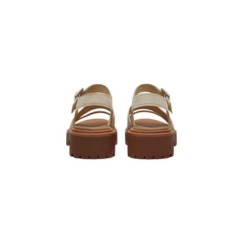 Cream-colored Timberland women leather platform sandals with tan leather straps and a chunky brown sole