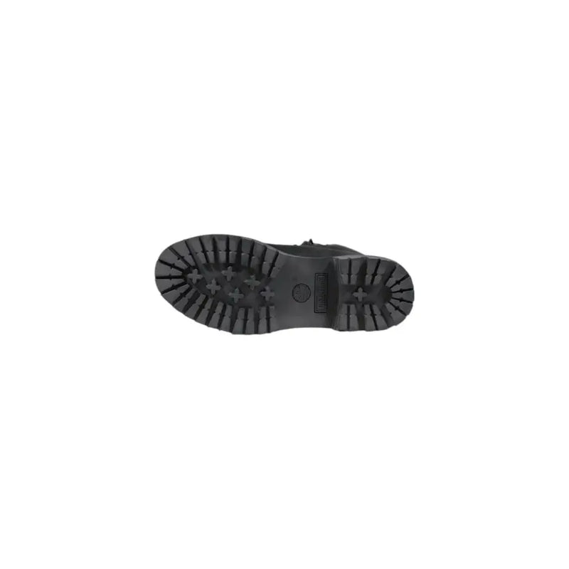 Timberland women’s black leather ankle boots with a rugged textured rubber sole and distinctive cross-shaped tread pattern