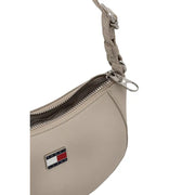 Beige tommy hilfiger women’s crossbody bag with braided strap and silver zipper zip pocket in tommy jeans material