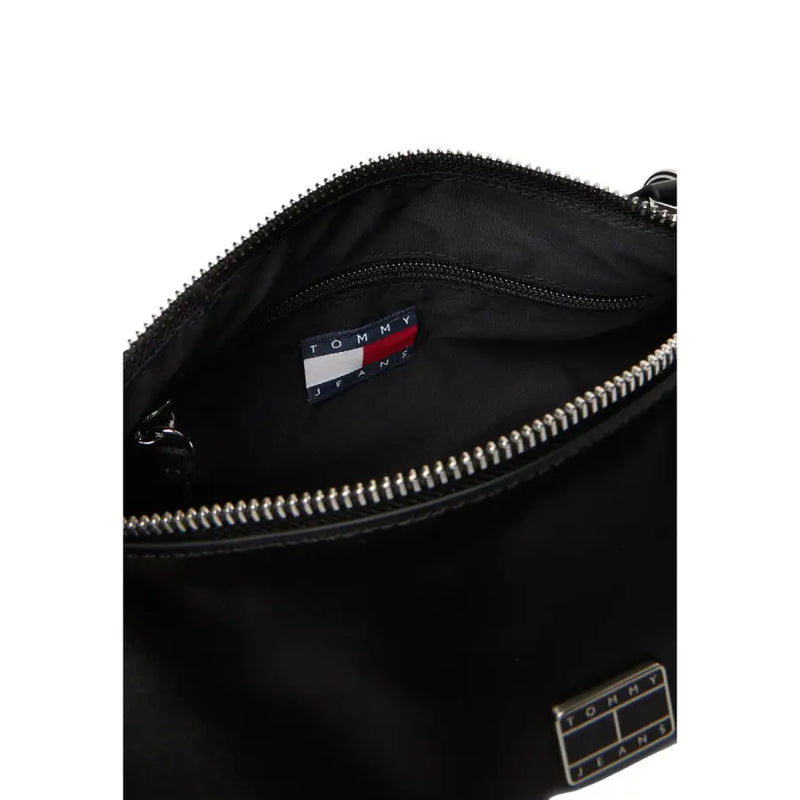 Tommy Hilfiger black faux leather handbag with silver zippers and branded patch and a zip pocket