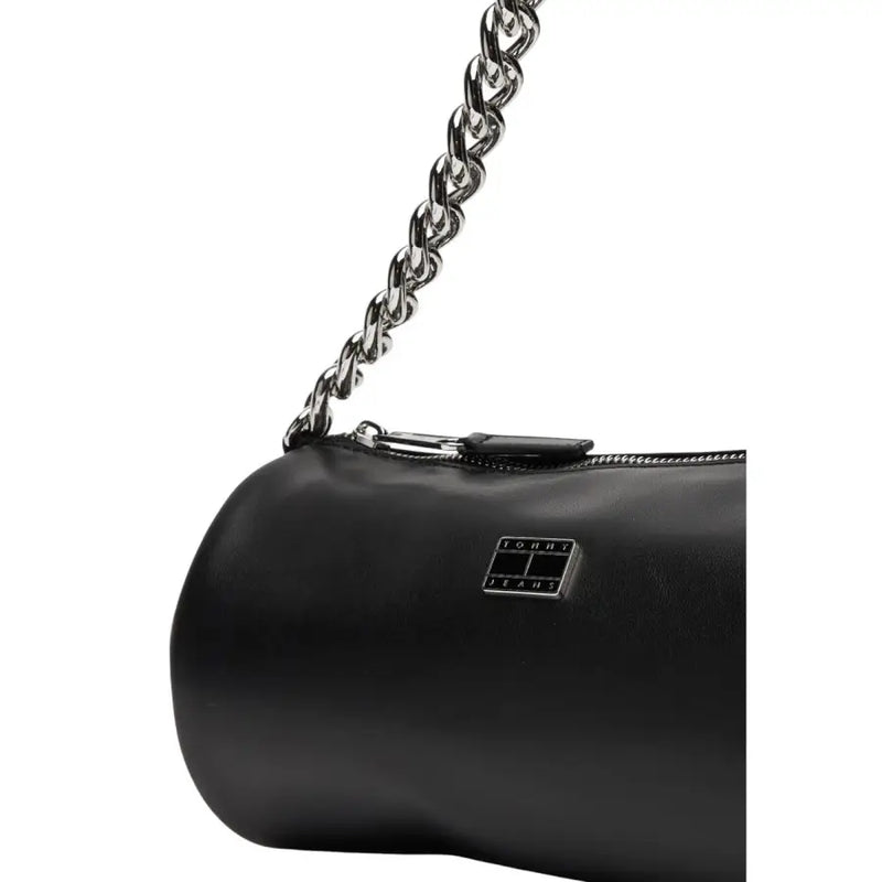 Tommy Hilfiger black faux leather handbag with silver chain strap and rectangular logo plaque with zip pocket