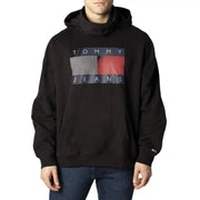 Tommy Hilfiger black hooded sweatshirt for men with bold graphic logo and gray red diagonal stripes on dark blue background