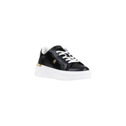 Black leather sneaker with white sole and gold accents, featuring a lace-up design.