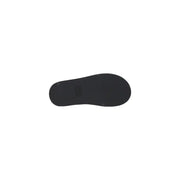 Black rubber sole with minimalist design and subtle brand logo on Tommy Hilfiger black leather wedge shoes for women