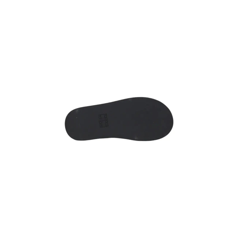 Black rubber sole with minimalist design and subtle brand logo on Tommy Hilfiger black leather wedge shoes for women