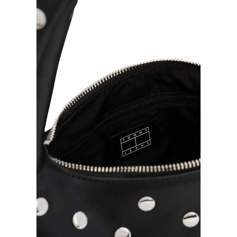 Tommy Hilfiger black polyurethane studded crossbody handbag with silver hardware and tommy jeans logo patch inside