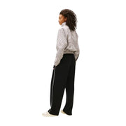 Tommy Hilfiger black women’s wide-leg track pants with white side stripe and embroidered logo on left thigh