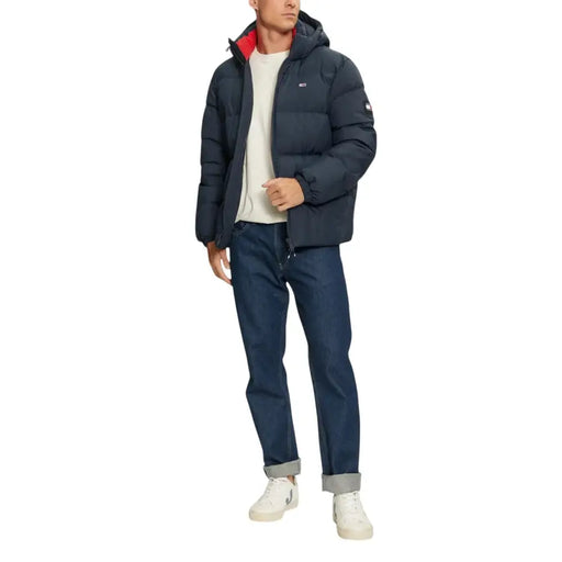 Navy blue puffer jacket with hood and white accents, tommy hilfiger brand.