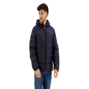 Marineblaue, gesteppte Polyamid-Kapuzenjacke für Herren mit kleinem rot-weiß-blauen Einsatz Tommy Hilfiger Logo auf der linken Brust
