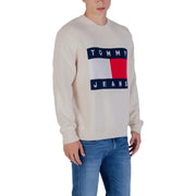 Tommy jeans cream-colored sweater with a bold red, white and blue logo.