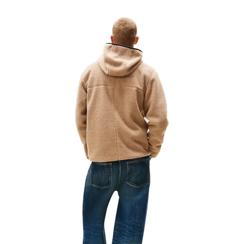 Men’s beige fleece hooded jacket with blue jeans from Tommy Hilfiger Jeans